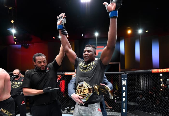 Francis Ngannou celebrates his victory over Stipe Miocic in UFC's heavyweight championship fight at UFC 260 on March 27, 2021.